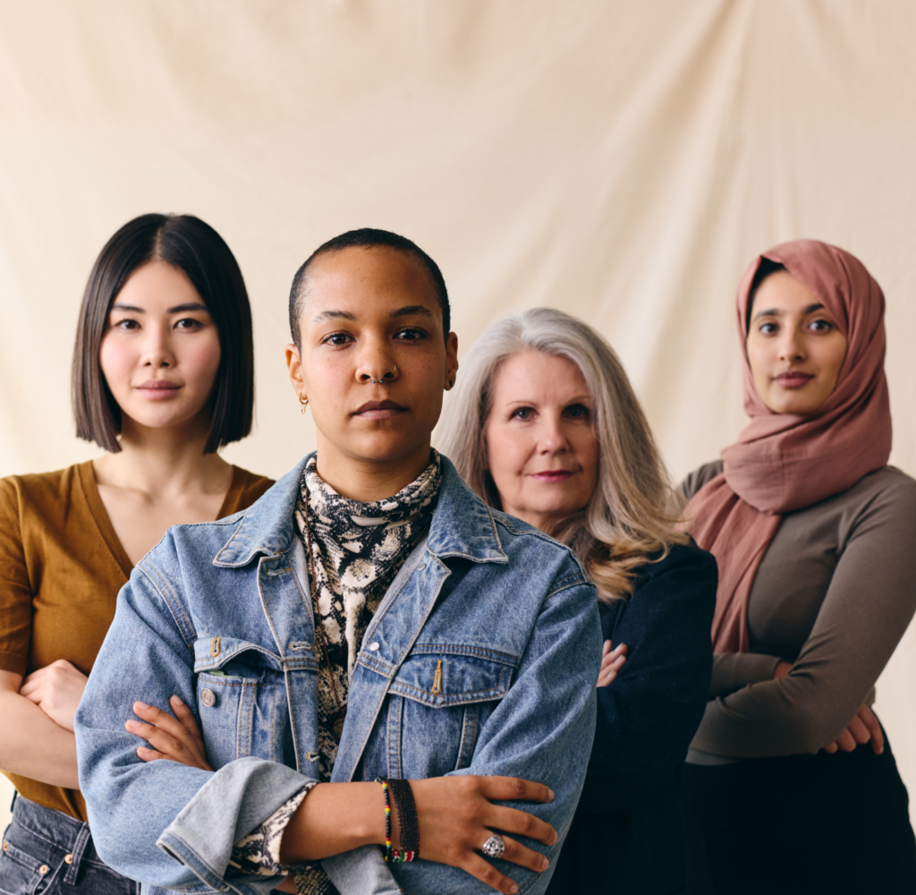 Four woman standing with their arms folded